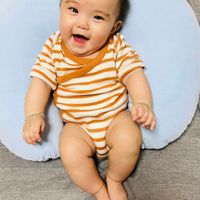 可能是 1 人、嬰兒和微笑的圖像