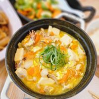 可能是水波蛋、粥、豆腐和文字的圖像