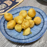 可能是炸丸子、豆腐、龍眼和文字的圖像