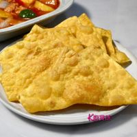可能是薄脆餅乾、豆腐和顯示的文字是「大唐賞味」的圖像