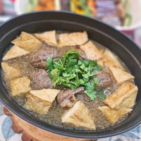 可能是火鍋、豆腐、麵和文字的圖像