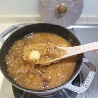 可能是木湯匙和粥的圖像