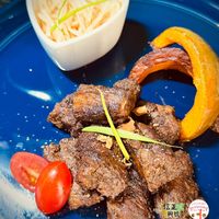 可能是肉排和文字的圖像