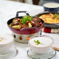 可能是起司火鍋、豆腐和粥的圖像