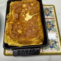 可能是巴布卡麵包、牧羊人派、舒芙蕾和文字的圖像