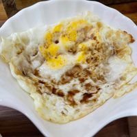 可能是粥、蛋黃和水波蛋的圖像