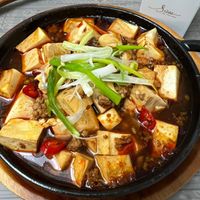 可能是火鍋、豆腐和文字的圖像
