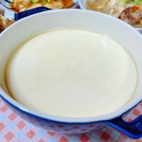 可能是粥、豆腐、起司火鍋和文字的圖像