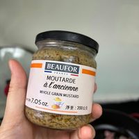 可能是顯示的文字是「 BEAUFOR FRANCE à MOUTARDE l'ancioDE e' l'ancienne WHOLE GRAIN WHOLEGRAINMUSTARD MUSTARD 區W7.05oz 7.05o W 净重：200公克 淨重： 200公克」的圖像