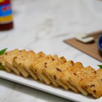 可能是豆腐、麵包棒和法式長棍麵包的圖像