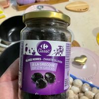 可能是食物、藥物和顯示的文字是「 ©Glaa Codimie Classic 200m7 OLIVES NOIRES ZWARTE ALAGRECQUE ZWARTEOLIJVEN OLIJVEN ALA GRECQUE OP OPZ'NGRIEKS Z'N GRIEKS Bania Paidts 2359 」的圖像