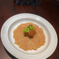 可能是粥、北非小米飯和燉小牛膝的圖像