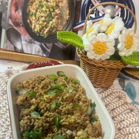 可能是牧羊人派、北非小米飯、炒飯和文字的圖像