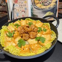 可能是豆腐、西班牙大鍋飯和文字的圖像
