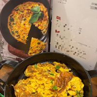 可能是歐姆蛋、豆腐、西班牙大鍋飯和文字的圖像