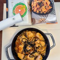 可能是豆腐、西班牙大鍋飯和文字的圖像