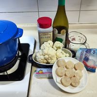 可能是起司火鍋、豆腐和文字的圖像