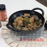 可能是北非小米飯、炒飯和文字的圖像