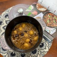 可能是豆腐、粥、火鍋、龍眼和文字的圖像