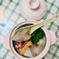 可能是豆腐、粥、火鍋和木湯匙的圖像