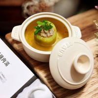 可能是火鍋、豆腐、粥和文字的圖像