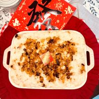 可能是‎豆腐、粥、炒麵、牧羊人派和‎顯示的文字是「 ‎New هو 我 Happy Maegg Newyear ear AE‎ 」‎‎ 的圖像