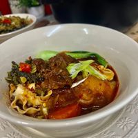 可能是燉小牛膝、豆腐和拉麵的圖像