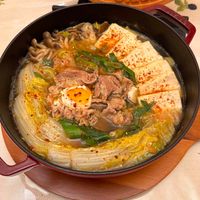可能是豆腐、拉麵、火鍋和文字的圖像