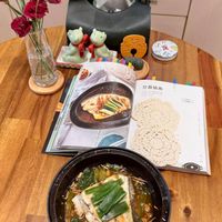 可能是火鍋、豆腐、麵和文字的圖像