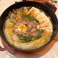 可能是火鍋、豆腐、拉麵和文字的圖像
