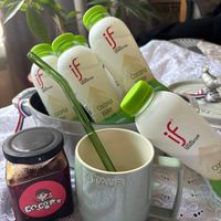 可能是‎飲料、藥物和‎顯示的文字是「 ‎if T if LENSATION ATon Coconut Coconut Coconut Coconut ធៃញ Coconut ATURAL ب SENSATION STAUB И‎ 」‎‎ 的圖像